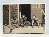 Soldiers with Puppies Postcard